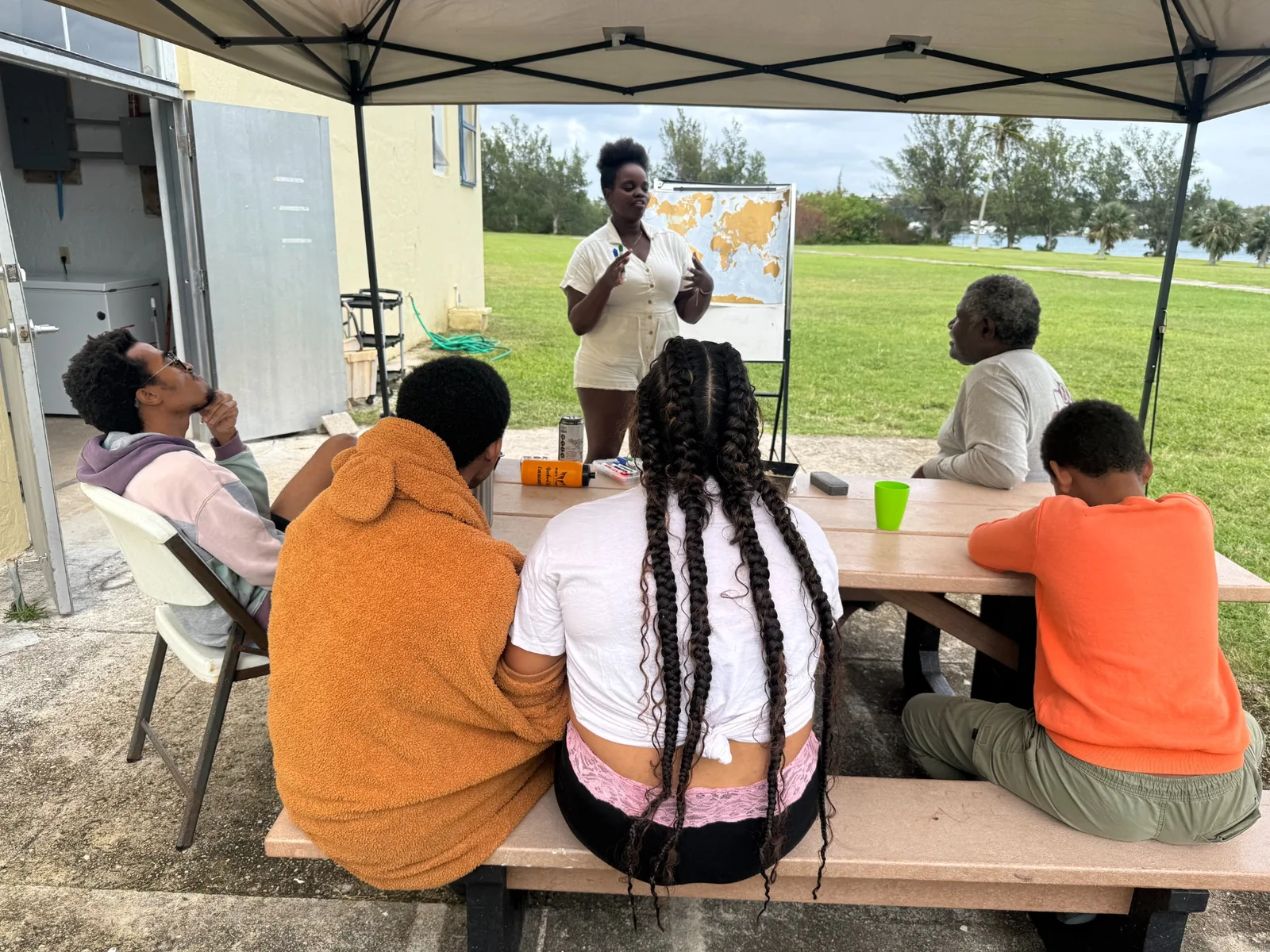Retreat participants sharing an outdoor workshop